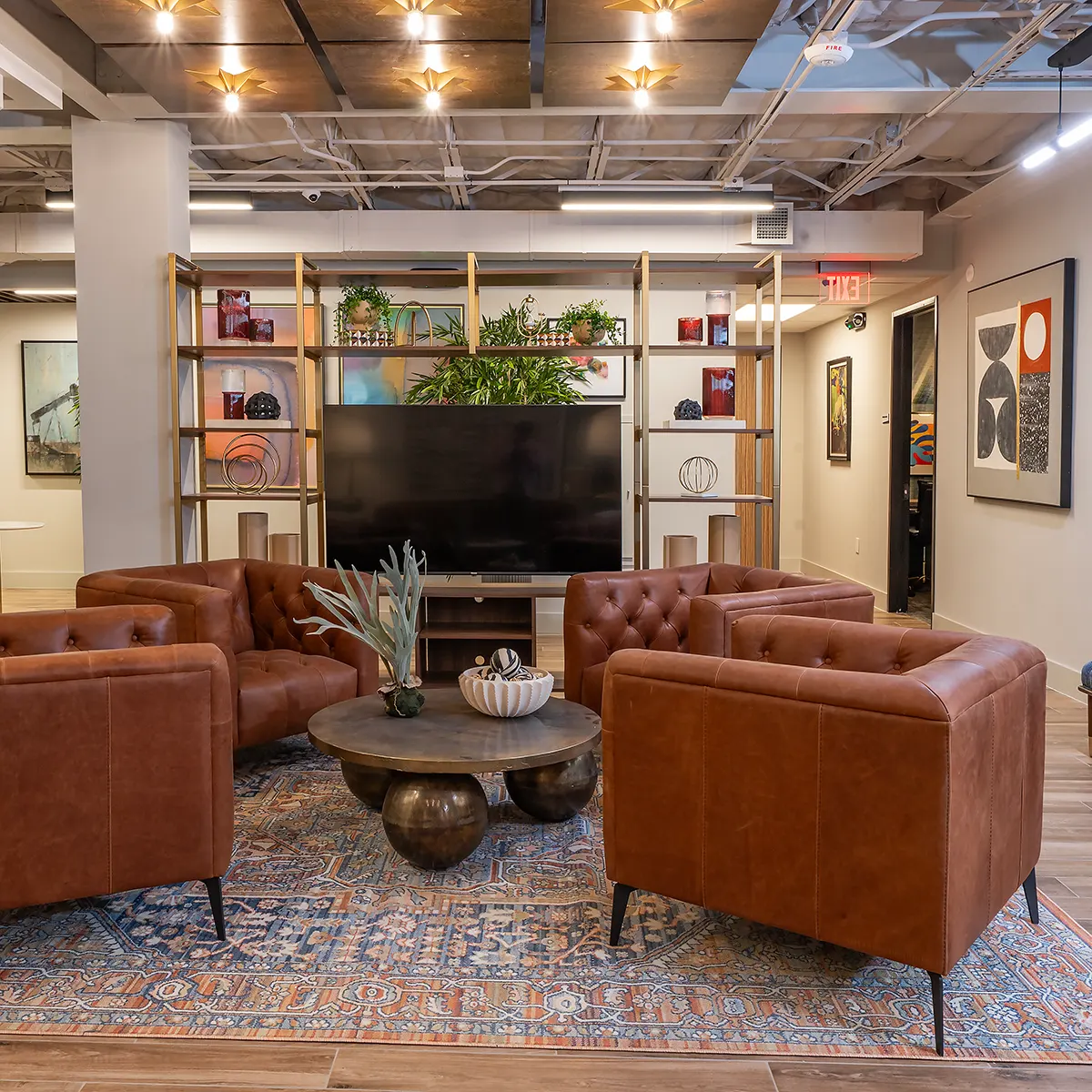 Office lobby in Houston, TX, featuring leather chairs and a television for guests