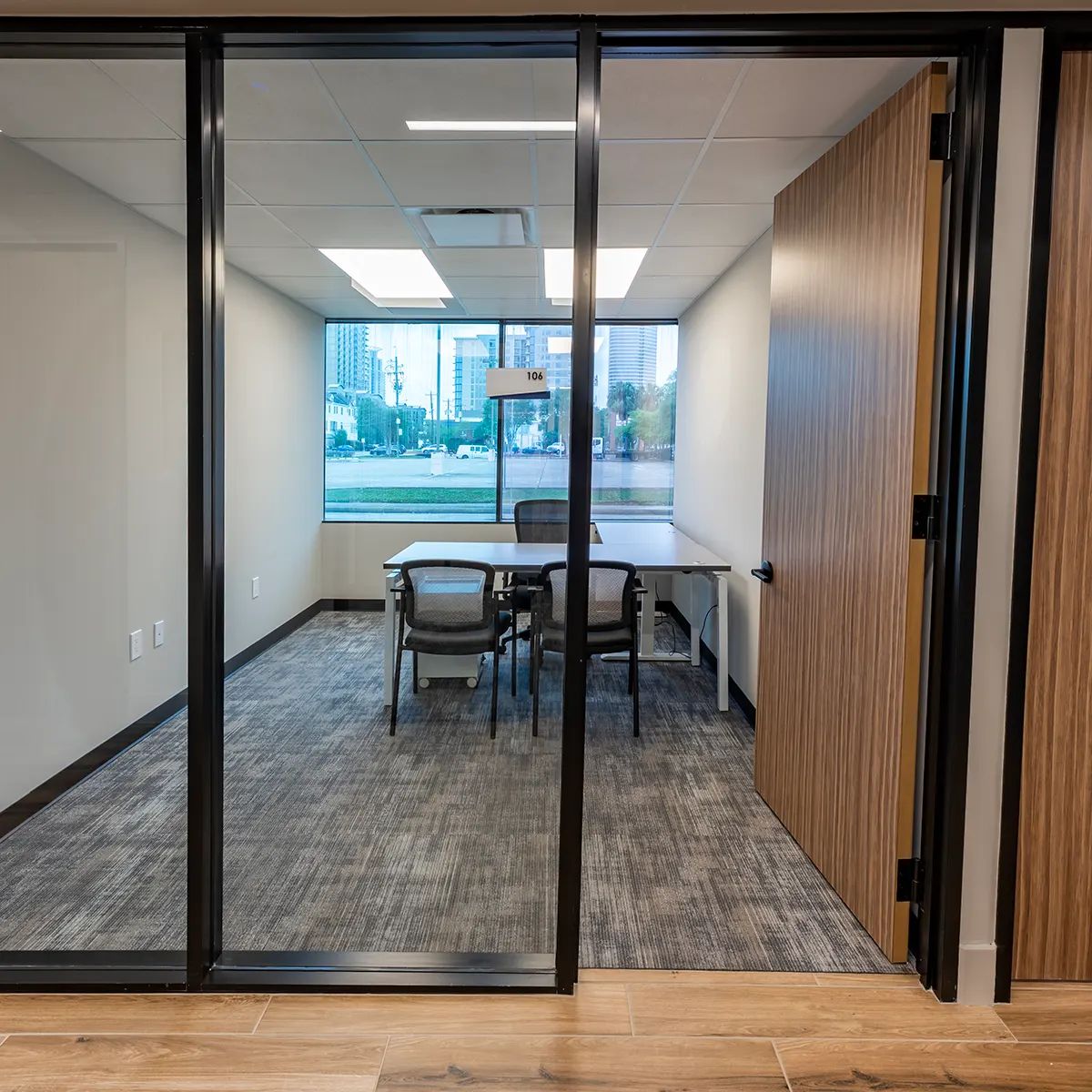Flexible Private Office Space featuring a conference room with glass door and a table in Houston, TX