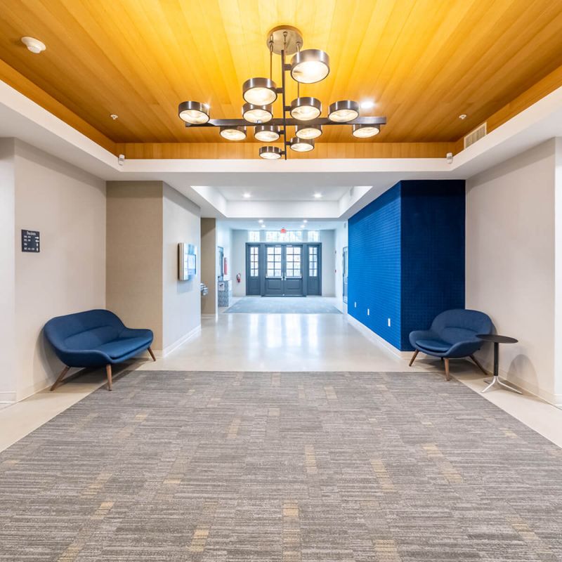 hallway with round chandelier lighting in office from Urban Office