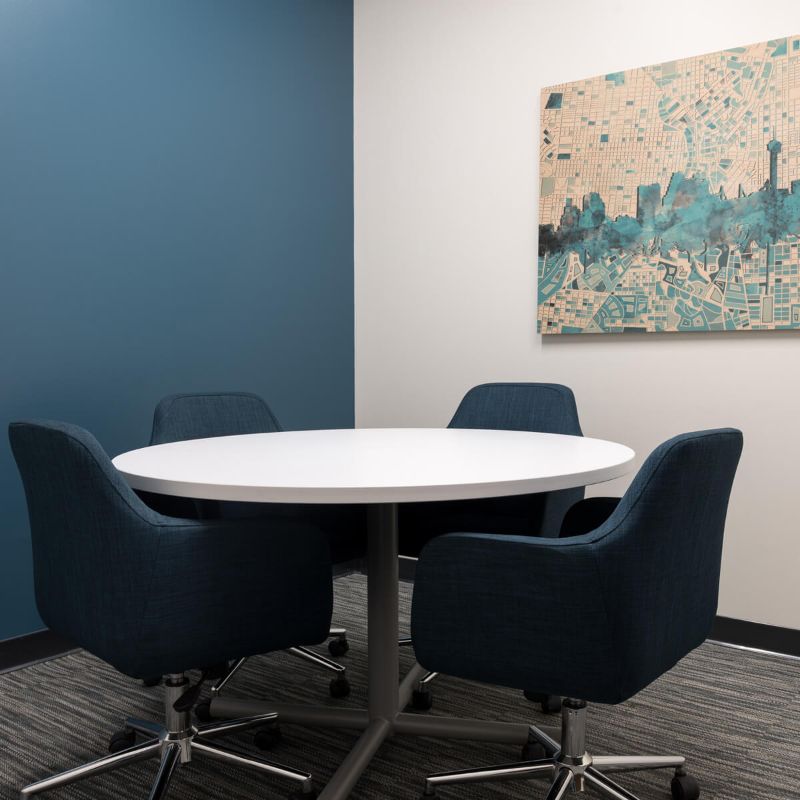 Blue chairs around table at Century Heights location from Urban Office